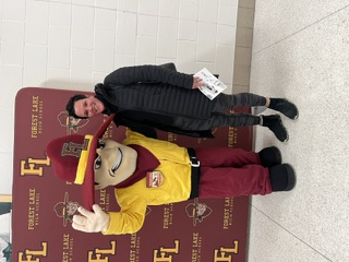 Jill with the Forest Lake Ranger mascot inside FLHS
