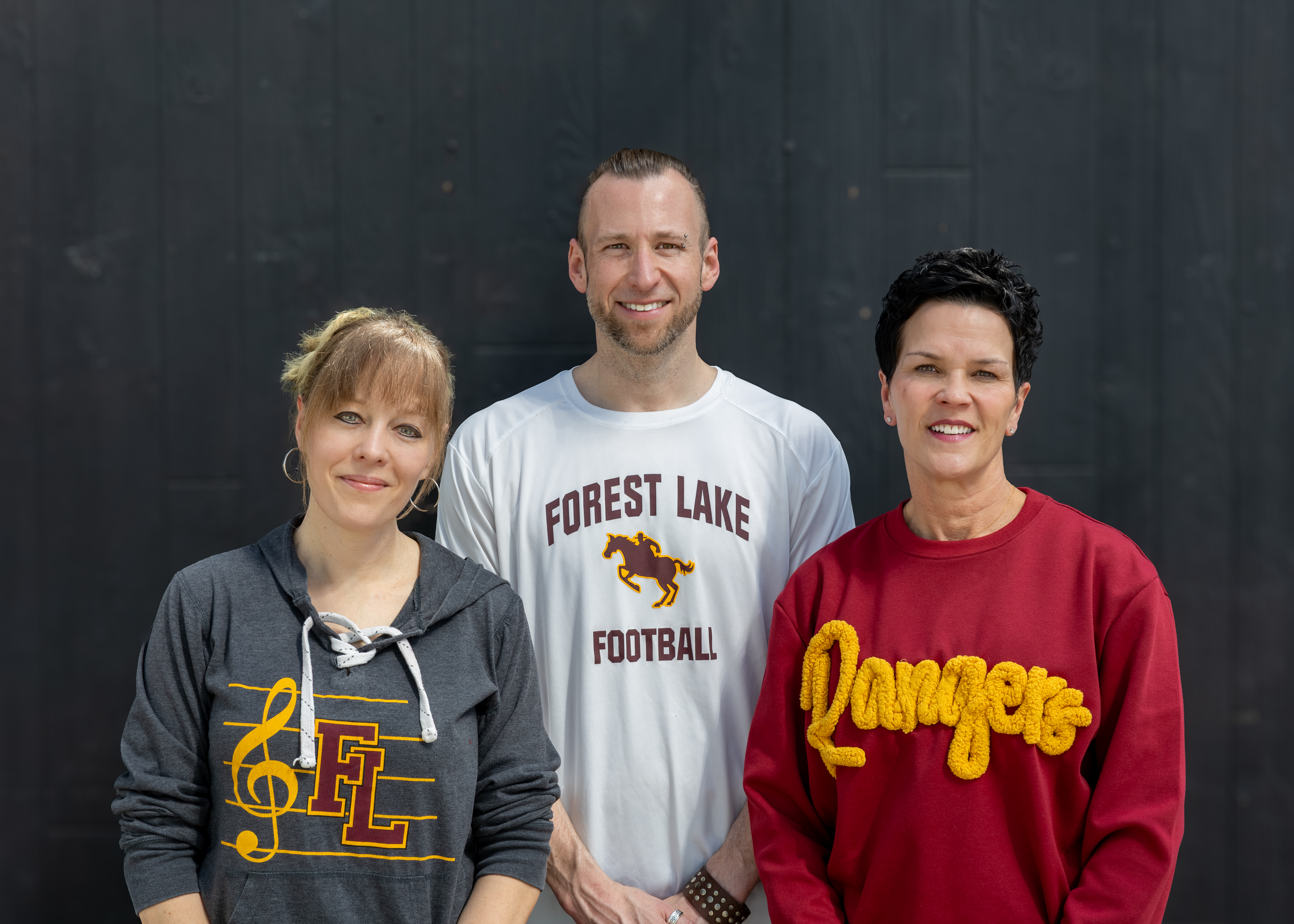 The FLAS Slate: Claire Luger, Andi Courneya, and Jill Christenson in Forest Lake school gear